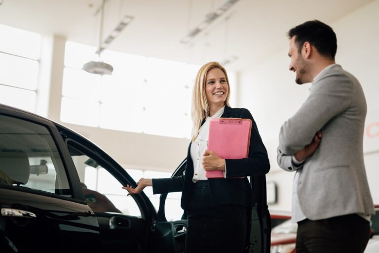 Professional salesperson selling cars